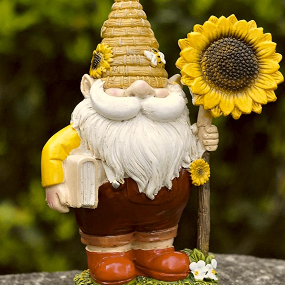 Nain de jardin avec livre et tournesol en résine